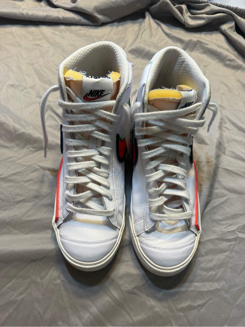Nike White High-Top Sneakers with Red and Green Swoosh Accents